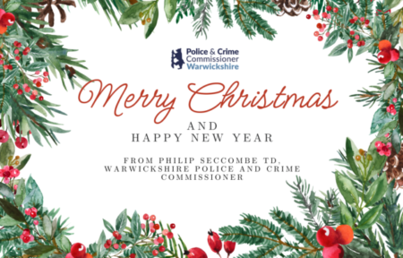 A Christmas card with holly and sprigs of Christmas trees saying 'Merry Christmas from Philip Seccombe'